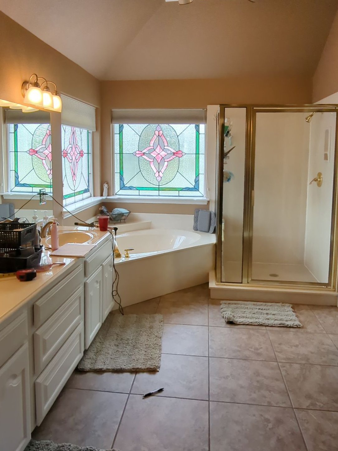 Before: original bathroom with stained glass windows