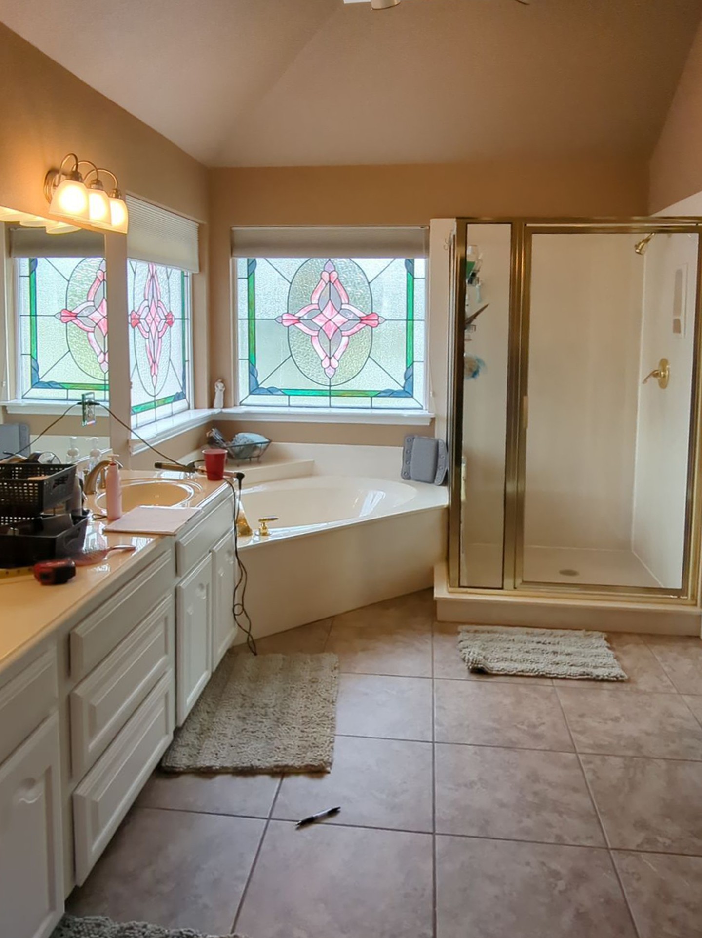 Before: original bathroom with stained glass windows
